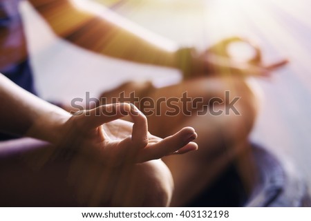 Closeup of woman's hands meditating indoors Royalty-Free Stock Photo #403132198