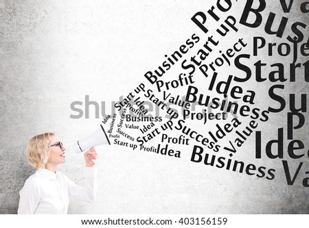 Businesswoman with white loudspeaker, words on topic of business development out of it. Grey background. Concept of business progress.