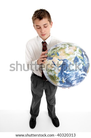A student schoolboy holds blow up ball of Earth. Pictures of the Earth from Nasa.  Eg, geography, astronomy, travel, environment, geo politics, countries,  earth, global and world related issues.