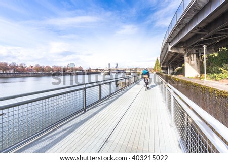 steel footpath on bridge with cityscape and skyline in portland