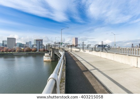 steel footpath on bridge with cityscape and skyline in portland