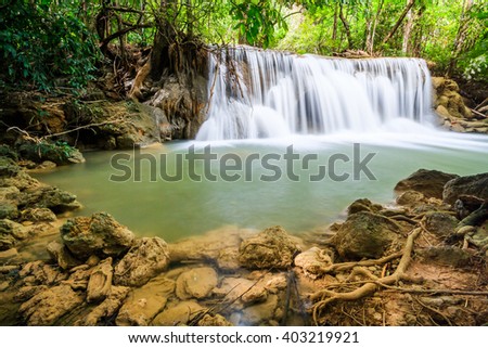 waterfall and tree root in Thailand National Park.