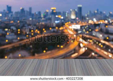 Opeing wooden floor,  Abstract blurred light background, city downtown and highway interchange night view