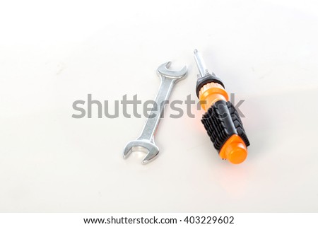  a Wrench and Screwdriver on white background, selective focus