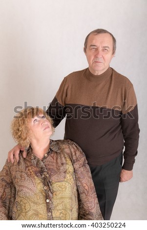 studio portrait of an elderly married couple