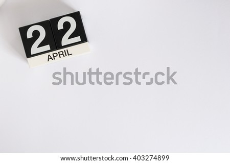 April 22nd. Earth Day. Image of april 22 wooden color calendar on white background.  Spring day, empty space for text Royalty-Free Stock Photo #403274899
