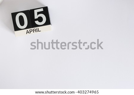 April 5th. Image of april 5 wooden color calendar on white background.  Spring day, empty space for text