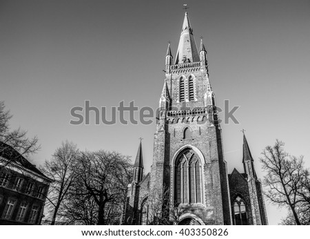 Medieval Church of Our Lady in Bruges in sunny evening, Belgium. Black-white photo.