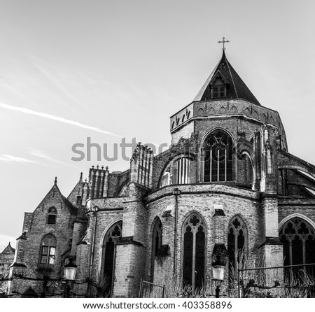 Medieval Church in Bruges in sunny evening, Belgium. Black-white photo.