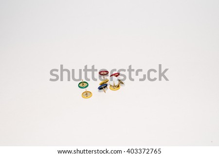lorful pushpin on a white background are a scattering of in a heap