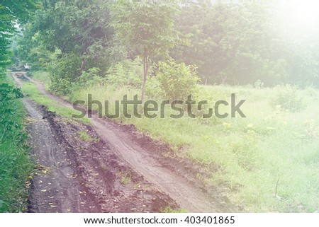 Background texture of the dirt road after rain, which traces its wheels used in Bus pick-up.