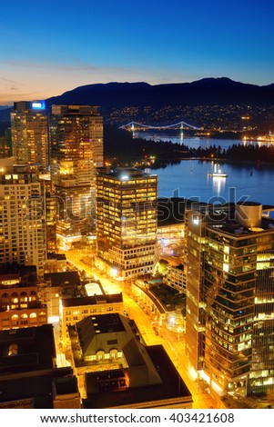 Vancouver rooftop view with urban architectures at dusk.