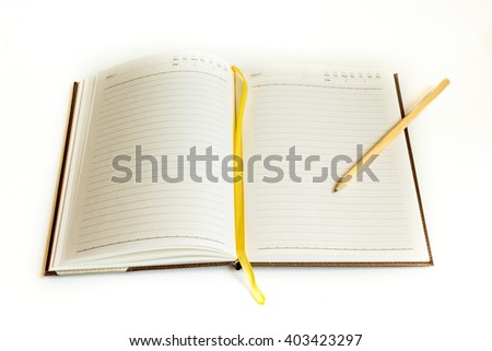 opened book and brown pencil on the white background