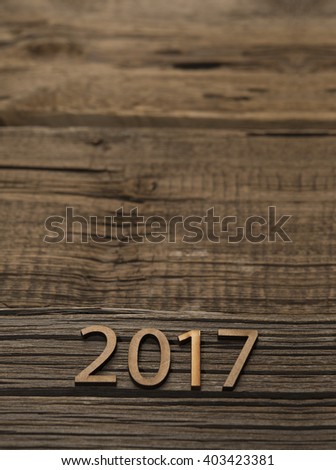 Sigh symbol from number 2017 on old retro vintage style wooden texture background Empty copy space for inscription or other objects Idea merry new year holiday year of cock