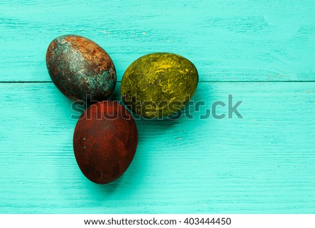 Easter eggs on a wooden table .Rustic style.Top view. Free space for text.