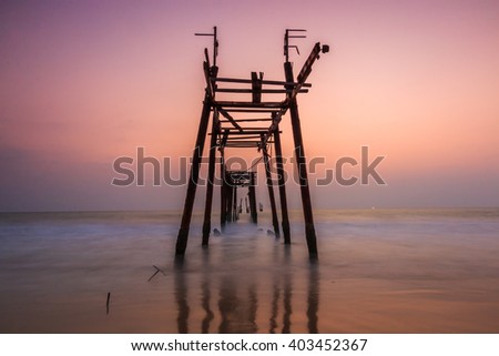Landscape sunset with old wooden bridge at Khao Pilai beach in Phang Nga province Thailand
