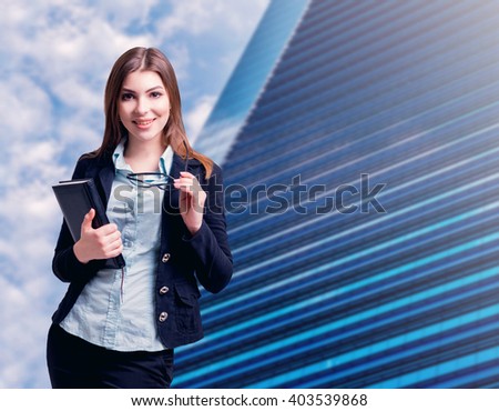Business woman on the city background.
