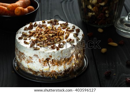 Homemade Paleo Gluten-Free Carrot Cake on Dark Wooden Background, Close-up