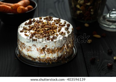 Homemade Paleo Gluten-Free Carrot Cake on Dark Wooden Background, Close-up