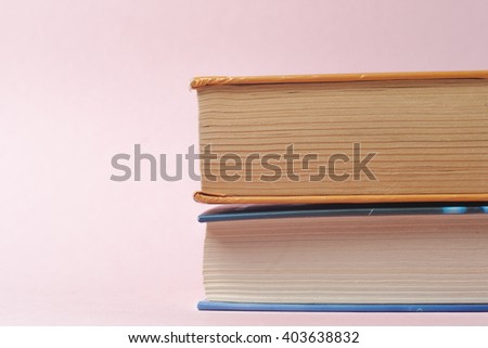 Vintage old books on  light background. Books and reading are essential for self improvement, gaining knowledge and success in our careers, business and personal lives. Copy space for text.