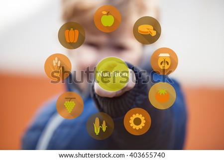 Child pressing nutrition icon on digital virtual screen. 