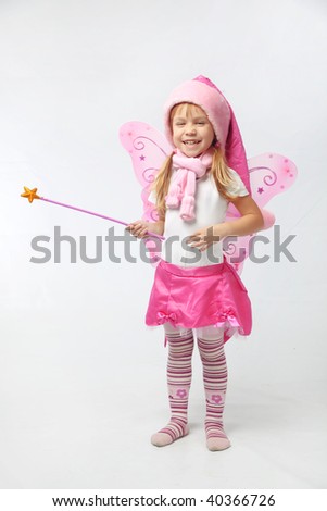 Portrait of sweet little girl in Christmas fairy costume