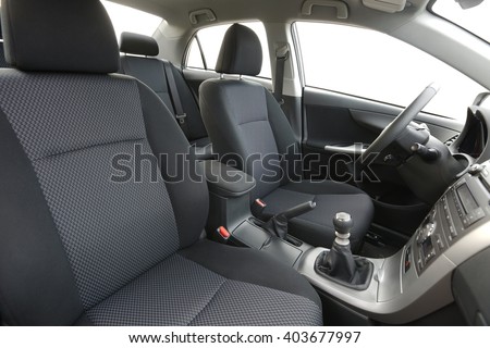 Car interior view of the dashboard from the back Royalty-Free Stock Photo #403677997