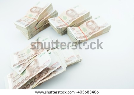 stack of 1000 bath Thai money : Thailand Currency 1000 Bath, BankNotes isolated on white background. with copy space and text here
