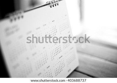 blurred calendar in black tone. Royalty-Free Stock Photo #403688737