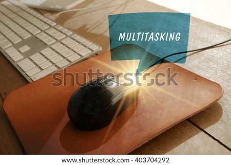 speech bubble MULTITASKING  concept  with workstation on black mouse computer, over light image , business concept 