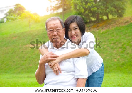 Senior man and daughter. Happy father talking with her daughter. Royalty-Free Stock Photo #403759636