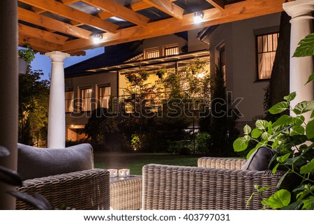Picture of beautiful residence with garden at night