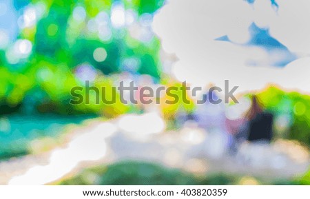 image of blur outdoor restaurant on day time with green tree bokeh for background usage . (vintage tone)
