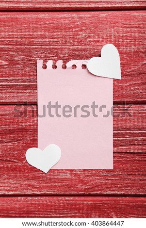 Love hearts on a red wooden table