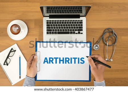 ARTHRITIS Doctor writing medical records on a clipboard, medical equipment and desktop on background, top view, coffee