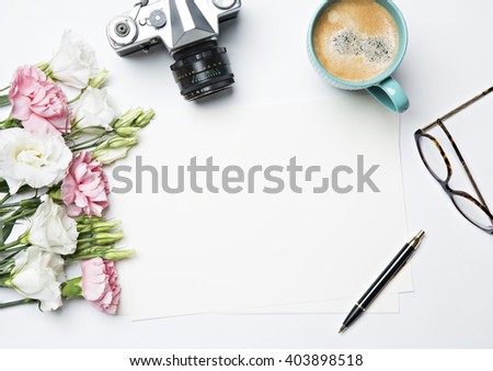 desk with coffee and flowers