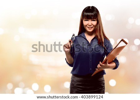 Image of pretty successful asian business woman