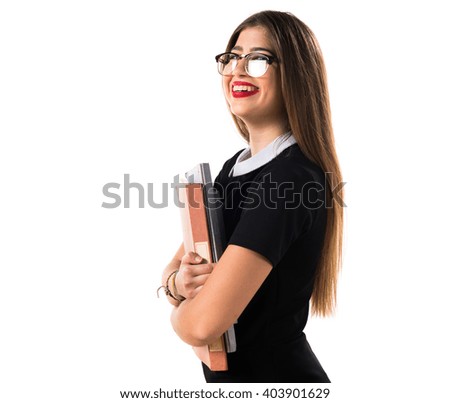 Girl holding several college notes