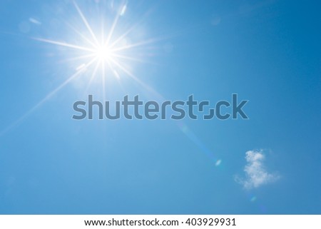 Blue sky and bright sun Royalty-Free Stock Photo #403929931