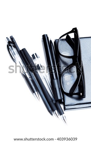 Notebook, pencil and glasses