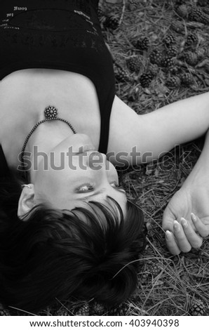 Beautiful girl lying on the grass