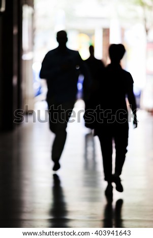 Abstract picture of a man running down the corridor; note shallow depth of field