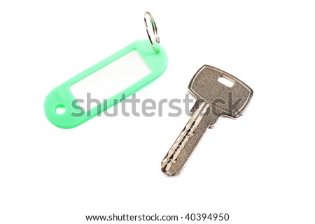 Key and green trinket with empty for your design space isolated on white background.