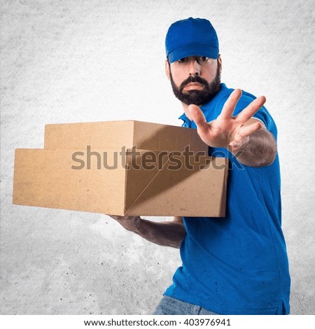 Delivery man making stop sign