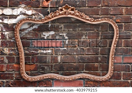 Old picture frame a a grunge red brick wall