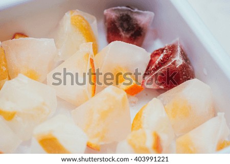 ice cubes with frozen fruits
