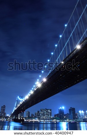 Manhattan Bridge and Manhattan skyline At Night Lights, NYC