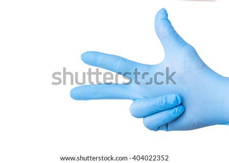 Hand in blue glove isolated on white showing number three.
