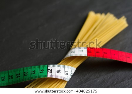 Italian food concept with centimeter flag and pasta