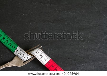 Italian food concept with centimeter and fork background